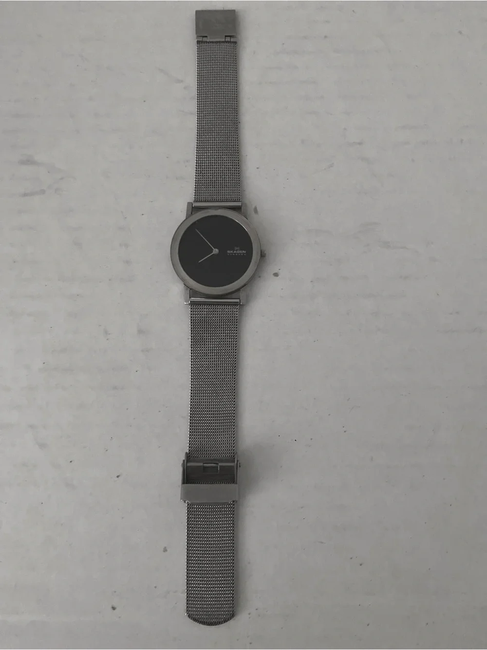 Skagen Modern Unisex Silver Mesh Watch with Black Dial.